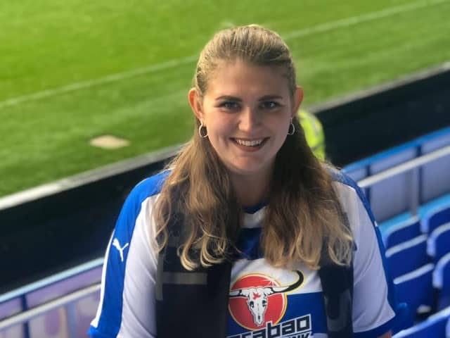 Russell's ashes are buried in the home goal at Reading Football Stadium. This photo was taken on game day, the first time Emily ever wore a football shirt.