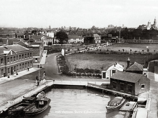 Where the lipstick tower now stands. In this picture we see what is the present location of the tower block in Gunwharf nicknamed the lipstick building. It is located roughly where the tree is standing centre photo. The photo was taken I believe, from the crane that loaded torpedoes into submarines in HMS Vernon. To the left is the present Customs House pub. The main gate is just out of sight to the right.
