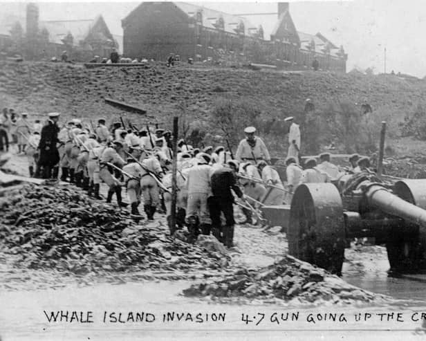 The White Force hauls a gun out of the mud and on to Whale Island during the Great War in 1904.