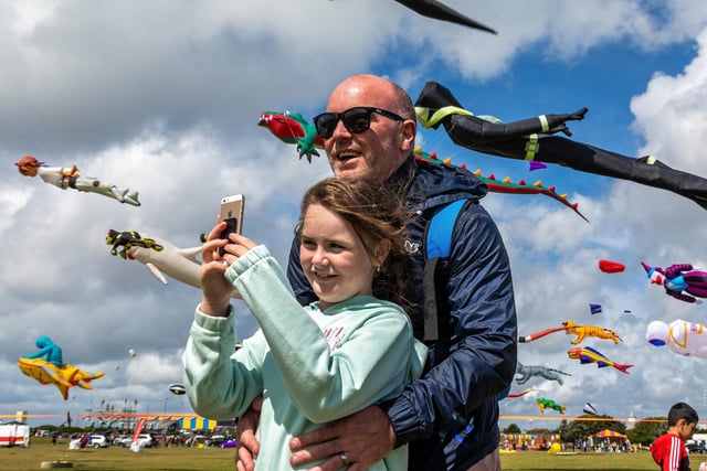 Frankie Glackin (9) chooses an epic backdrop for a selfie with her dad Marcel Glackin (44). Picture: Mike Cooter (070821)