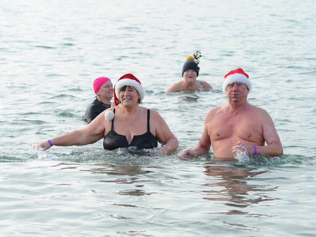 Sue and Dave Castle from Lee-on-the-Solent, enjoying their first Boxing Day dip. Picture: Sarah Standing (261224-521)