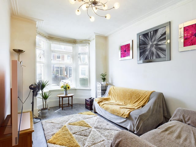 The front door opens on to the hallway with access to all ground floor rooms. The front reception has a bay window allowing light in and original coving adds character to the room.