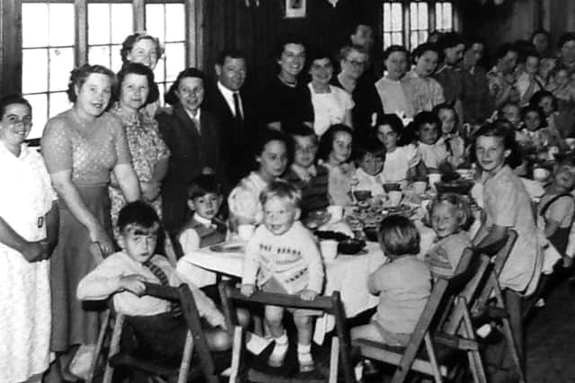 Children and parents at a Christmas party in December 1951 held in the hall alongside the Cricketers Tavern, Stockheath.