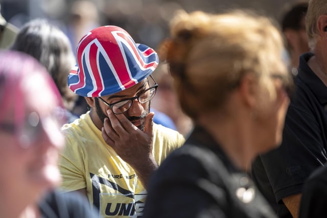 An onlooker tears up at the ceremony.