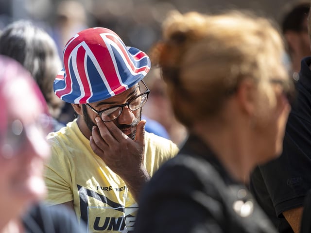 An onlooker tears up at the ceremony.