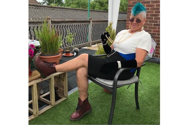 Jill looking the part with a glass of champagne and some Dr Martens boots