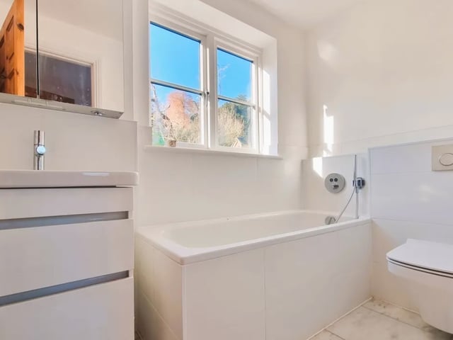The listing says: "The first-floor arrangement has two bedrooms, a dressing / study area and bathroom, from the second bedroom is a steep ladder style staircase leading to a boarded loft room."