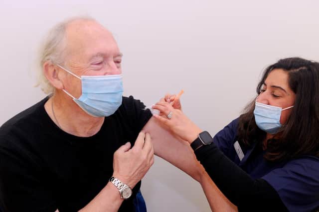 Laurence Killick (72) from Emsworth, receiving the Covid-19 vaccination from Greywell Pharmacy superintendent Mita Thakrar.
Picture: Sarah Standing (040221-2243)