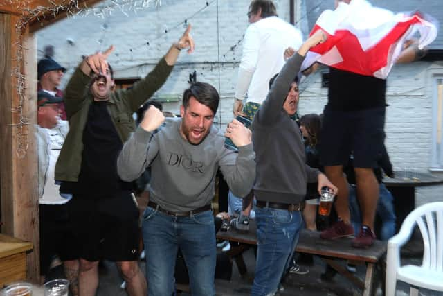 England fans pictured at the Milton Arms in Portsmouth, UK, about to watch England play on TV in the Semi-finals at Wembley.

Pictured are fans enjoying the night.

Picture: Sam Stephenson