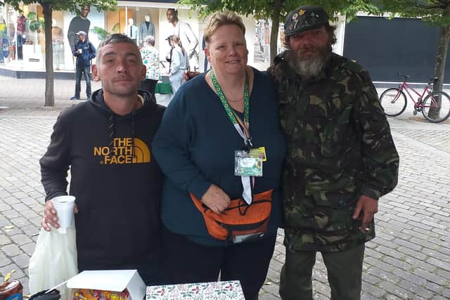 Charitable organisation Helping Hands Portsmouth is celebrating four years of feeding homeless and vulnerable people in the city. Pictured: Founder Bev Saunders, middle, celebrating the anniversary