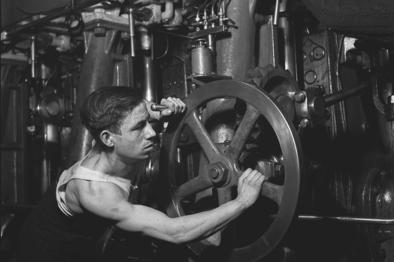 A crew member working below decks on a Royal Navy minesweeper during World War II, March 1941.  (Photo by Horace Abrahams/Keystone Features/Hulton Archive/Getty Images)