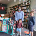 Co-owner Phil Davies with customers Laura Trowern and her children, Rupert, two, and Oscar, eight. Picture: Chris Moorhouse (jpns 190621-01)