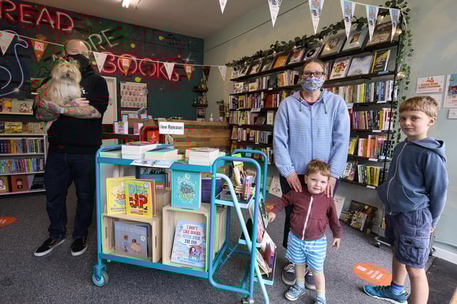 Co-owner Phil Davies with customers Laura Trowern and her children, Rupert, two, and Oscar, eight. Picture: Chris Moorhouse (jpns 190621-01)