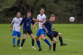Padnell (blue) v AC Copnor Reserves. Picture: Mike Cooter