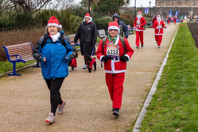 Runners undeterred by the weather start the Santa Fun Run at Southsea Castle