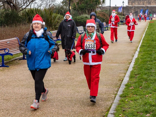 Runners undeterred by the weather start the Santa Fun Run at Southsea Castle