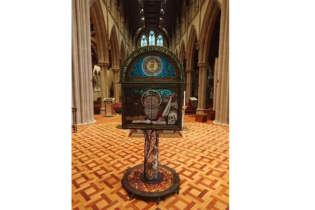 Portsmouth-based artist Pete Codling has created a mosaic depicting the achievements of St Jerome which is being displayed in St John's Catholic Cathedral. Pictured: St Jerome works at translating the Bible on a laptop, with his scrolls in the background