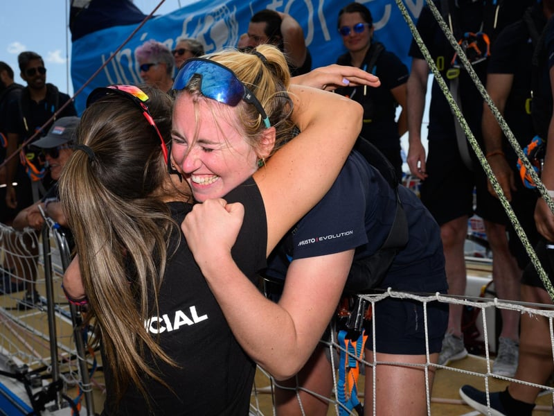 Crew members return to hugs and greetings from family and friends.Picture: Keith Woodland (270721-22)