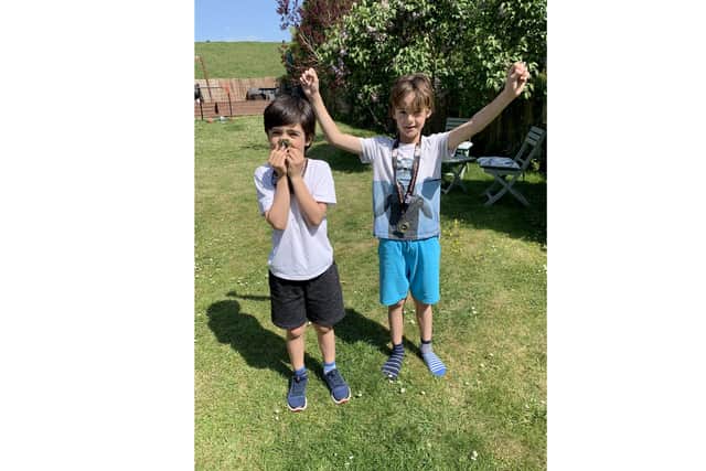 Leo and Max McHugh ran the length of a marathon to raise funds for the NHS and received a medal each when they completed it on Sunday, the date of the original London Marathon.