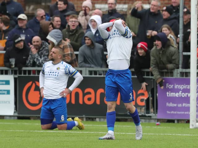 Joe Newton (right) reacts after Sam Magri (on knees) had been adjudged to have given away a penalty. Picture by Dave Haines