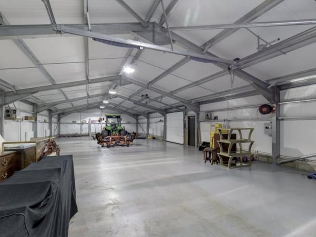 The traditional barn comprises a store room and garage, with a garage/machinery shed and workshop. It leads to a kennel and dog run.