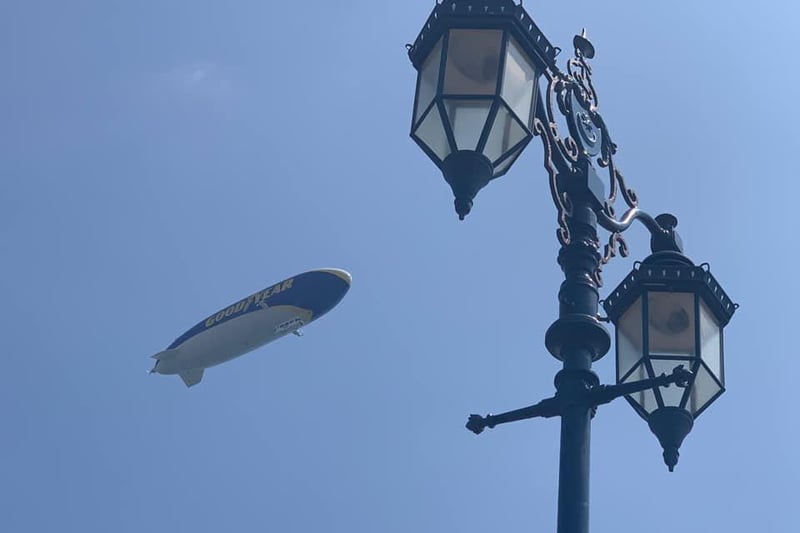 The Goodyear Blimp flies over Eastney, past the seafront's popular lampposts. Picture: Josh Houghton