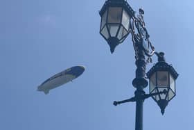 The Goodyear Blimp flies over Eastney, past the seafront's popular lampposts. Picture: Josh Houghton