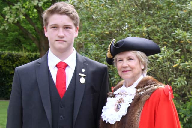 Michael Guthrie,  pictured with Fareham mayor Susan Bayford as he picked up the Junior Citizen award in 2018. He has now become the fourth person in his family to join the Royal Navy.
Photo: Fareham Borough Council
