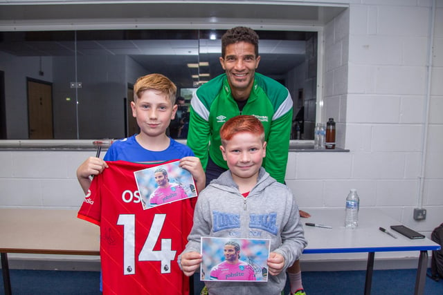 Pictured: David James with Oskar 12 and Joshua 9 at Bay House School, Gosport
