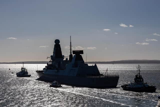 HMS Diamond heads into the Solent after leaving Portsmouth Harbour. Picture: Mike Cooter (250222)