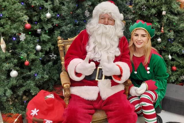 Santa and his Elf look forward to meeting you