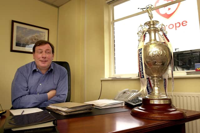 Peter Storrie with the First Division trophy after Pompey's 2002-03 title win. Picture: Malcolm Wells