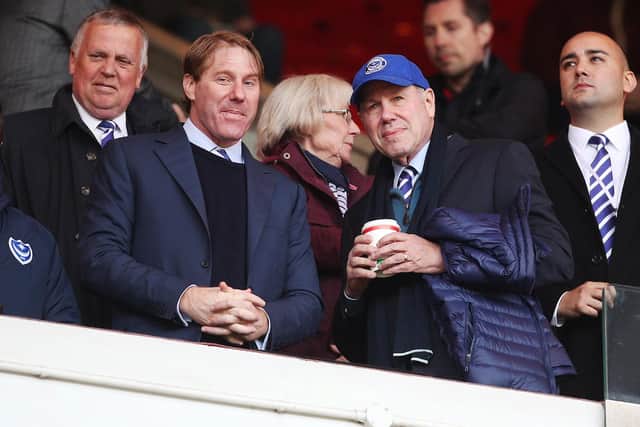 Pompey chairman Michael Eisner, right, with son Eric