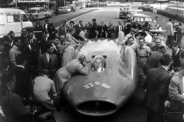 20th July 1960:  Donald Campbell (1921- 1967) in the cockpit of 'Bluebird CN7' after tests at Goodwood Motor Track. Campbell hopes to break the World land speed record with the car at Bonnevile Salt Flats in Utah, America.  (Photo by Evening Standard/Getty Images)