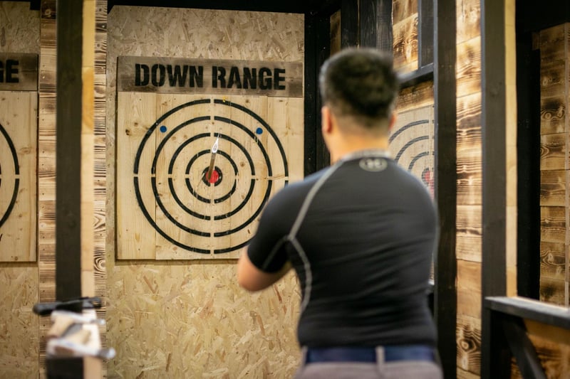 Pictured: Ming Wu having a go at throwing an axe
Picture: Habibur Rahman