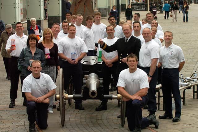 HMS Collingwood field gun team stop for a photograph in Fareham Shopping Precinct at West Street, with Rainbow Centre service secretary Jo Candy, left, and office manager Julie Woodward, after pulling their gun and limber from the naval establishment in Newgate Lane. They were raising sponsorship for the Rainbow Centre in May 2006