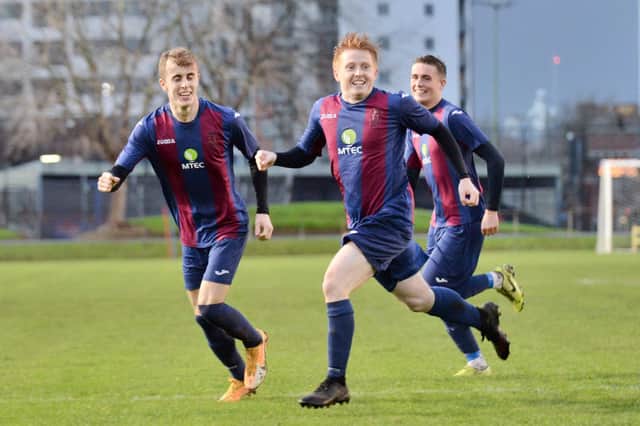 Frankie Paige (foreground) wheels away after scoring for US Portsmouth in their 3-2 Vase third round win over Millbrook in December. Pic: Martyn White.