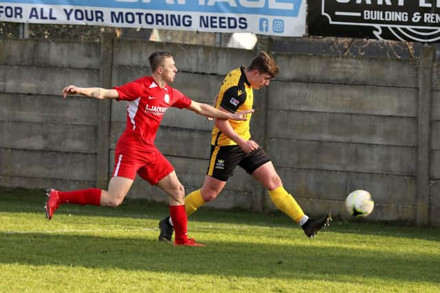 Horndean's Zak Willett chases Baffins defender Rhys Lloyd.
Picture: Sam Stephenson.