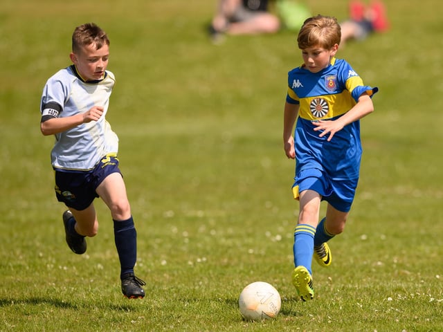 Action from the Clanfield youth football tournament at Horndean Technology College. Picture: Keith Woodland (270521-378)