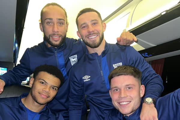 Conor Chaplin joins former Pompey players George Hirst, Dane Scarlett and Marcus Harness to enjoy their win on the way home from Southampton