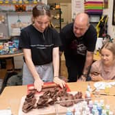 Pictured is:  Clarice Westcoombe, Steve Neville from the The Crafty Makery and Layla Lee making poppies.

Picture: Keith Woodland (021021-9)