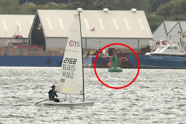 Pictured: The rib struck this green buoy (circled) in Southampton water, Hampshire police confirmed. Picture: Simon Czapp/Solent News & Photo Agency.