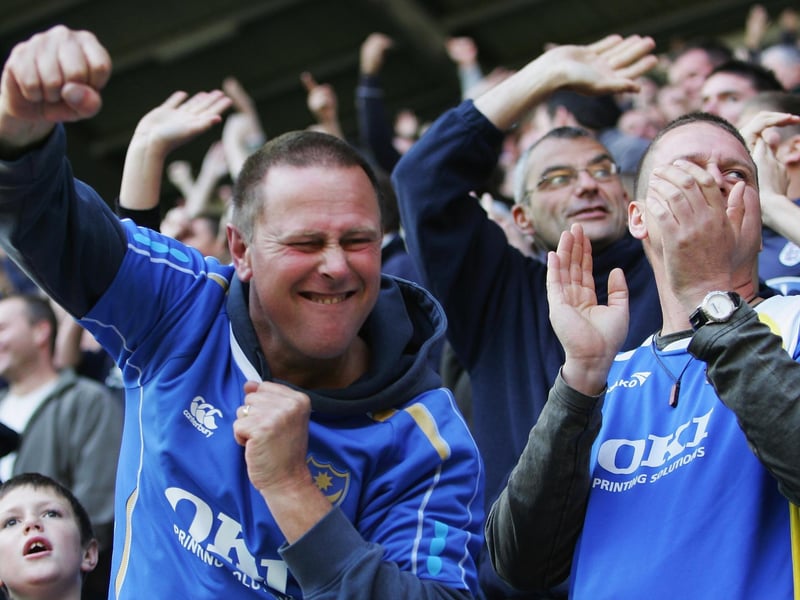 Pompey fans celebrate a Premier League win at Wigan Athletic in October 2007. Picture: Matthew Lewis/Getty Images