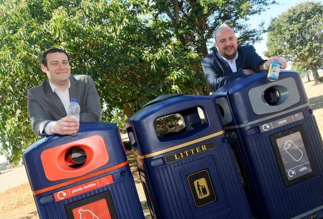 Pictured is: (l-r) Councillors Dave Ashmore, cabinet member for environment and climate change and Steve Pitt, deputy leader of Portsmouth City Council with the some of the new recycling bins that were installed in August.
Picture: Sarah Standing (060820-2040)