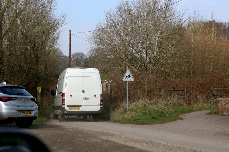 Film crews at the entrance to Little Woodham Village in February 2018, while filming of Doctor Who took place.