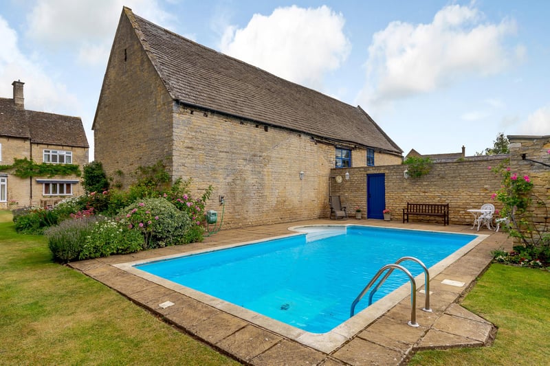 This pool is in the grounds of an eight-bedroom farmhouse for which offers over £1.75 million are wanted.