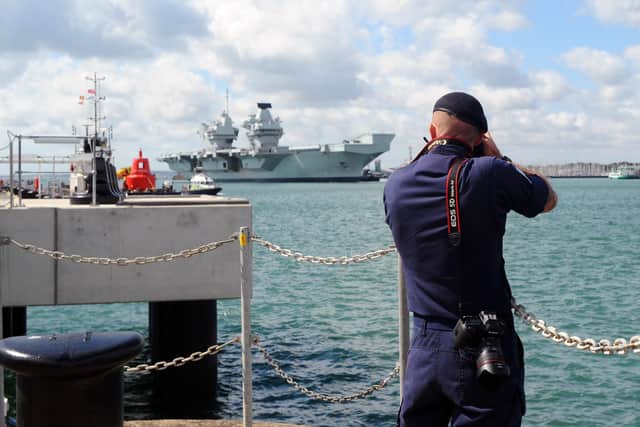 A Royal Navy photographer captured HMS Queen Elizabeth returning to Portsmouth.
Picture: Sarah Standing (020720-799)