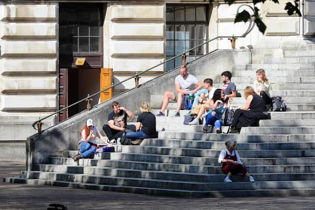 People gathered on the Portsmouth Guildhall steps. Picture: Sarah Standing (140920-7186)