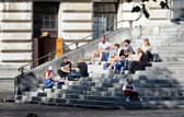 People gathered on the Portsmouth Guildhall steps. Picture: Sarah Standing (140920-7186)
