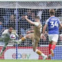 The moment Josh Oluwayemi was clattered by Sam Vokes, subsequently forcing him off with concussion in the 64th minute. Picture: Jason Brown/ProSportsImages